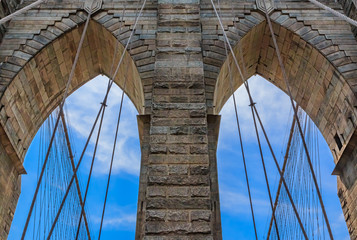 Fototapeta premium Closeup of the pointed arches above the passageways through the stone towers of the Brooklyn bridge in New York City USA