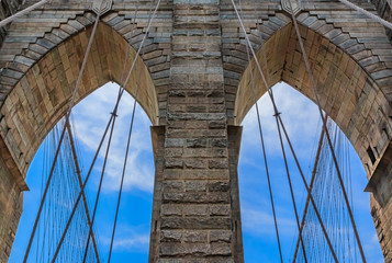 Closeup of the pointed arches above the passageways through the stone towers of the Brooklyn bridge in New York City USA