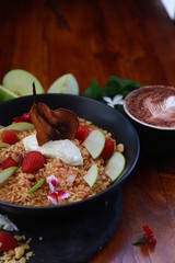 Crunchy Granola with dehydrated organic pear, sliced green apple, strawberries and vanilla bean yoghurt