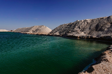 Fototapeta premium Siwa Oasis, Egypt The Siwa salt lakes which are used ot produce salt for export.