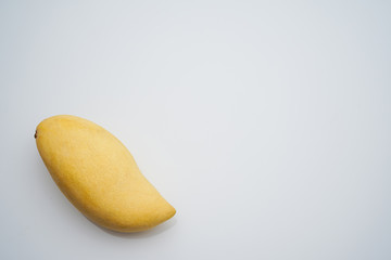 Yellow ripe mango on white background
