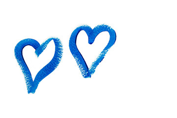 Two blue hearts hand drawn with acrylic paint isolated on white background. Love symbol. Valentines day background. Trendy classic blue color. Close-up