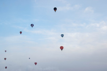The hot  air baloons fest in Russia. Apples on the snow. Colorfull balloons in the winter skye
