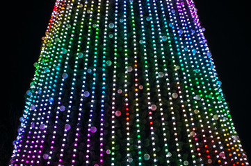 Big christmas tree decorated with colorful lights