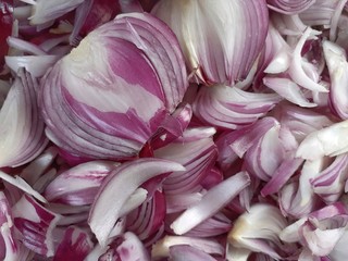 Raw chopped onions background. closeup image of fresh cutted online