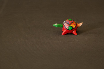 Red wooden turtle made of Mexican handicraft