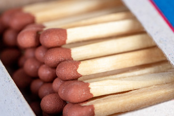 Wooden matches in a box close up. Fire.