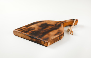 Rustic paddle shaped cutting board