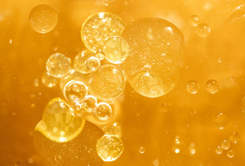 golden yellow bubble oil droplet, abstract background