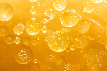 golden yellow bubble oil droplet, abstract background