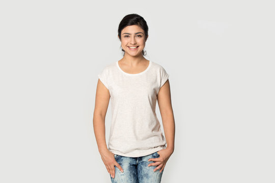 Indian millenial confident woman wearing white mock up t-shirt.