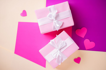 Valentine's, Mother's or Women's Day celebration. creative layout of festive heart shaped decorations and gift boxes, copy space. holidays background concept
