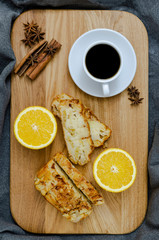Orange cake with a cup of coffee