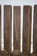 Sea view through concrete pillars.