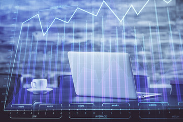 Stock market graph and table with computer background. Double exposure. Concept of financial analysis.