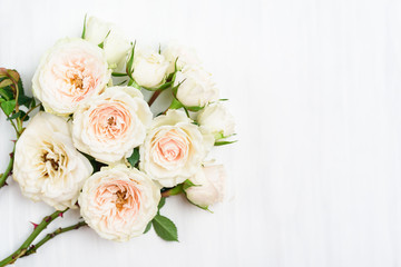 Beautiful white roses flower bouquet on white table