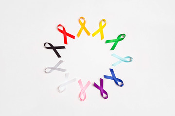 World cancer day concept, February 4. Circle of  colorful awareness ribbons on white background. Copy space for text.