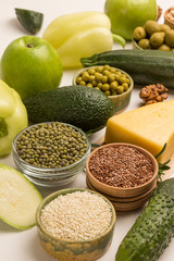 Alkaline foods. Sources of omega 3. Set of healthy food: cheese, green vegetables, nuts and seeds.