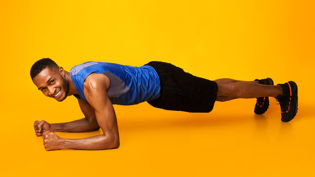 Fit Afro Sportsman Doing Plank Core Exercise