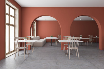 Orange restaurant interior with arches and sofa