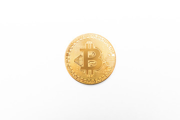 Bitcoin physical gold coin isolated on white