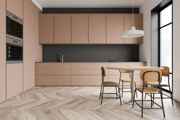 Beige kitchen interior with round table