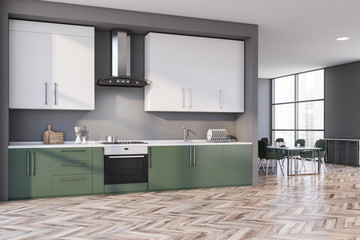 Gray and green kitchen corner, counters and table
