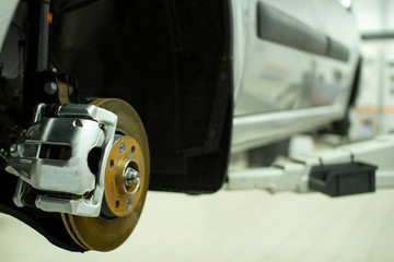 Fototapeta premium Cars in the service station. Maintenance of the car .