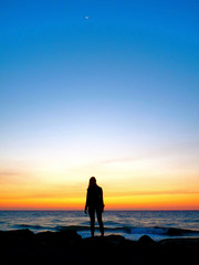 Fototapeta premium Sunset Beach Woman Silhouette in Tel Aviv, Israel