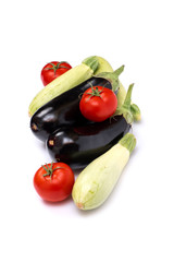 Zucchini and eggplant isolated on white background. Fresh vegetable marrow isolated on white background. Tomatoes , zucchini, eggplant on isolated white background..