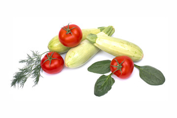Zucchini with tomatoes isolated on white background. Fresh vegetable on white background. Tomatoes , zucchini, on isolated white background.