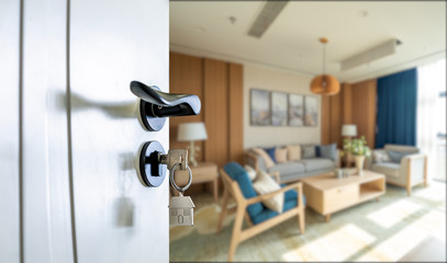 Naklejka premium Open door with keys, key in keyhole