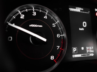 Tachometer RPM and display close-up on dashboard in interior of modern car