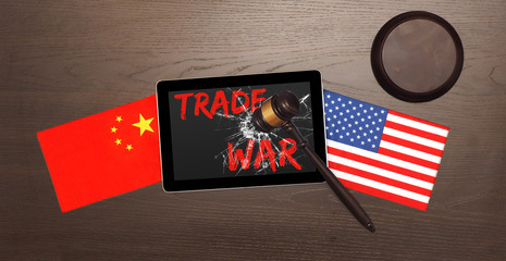China and USA flags on the table. Concept the trade war.