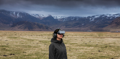 Young woman experiencing virtual reality in the outdoors
