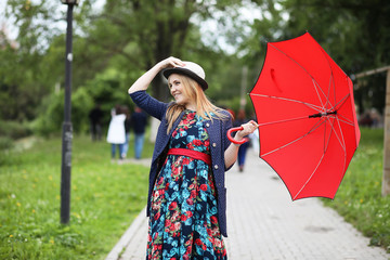 Girl in the street with an umbrella