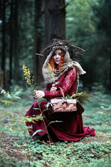 The red-haired witch holds a ritual with a crystal ball