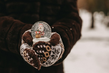 Woman holding a snow globe