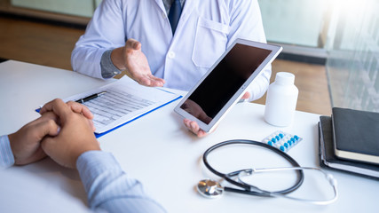 Doctor giving medical consultation diagnostic,Medical physician working in hospital, Healthcare concept.