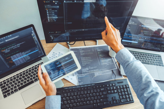 Developing programmer Development Website design and coding technologies working in software company office