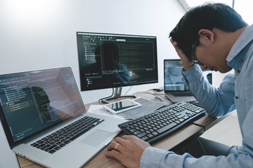 Programmer Typing Code on desktop computer, Developing programming and coding technologies concept.