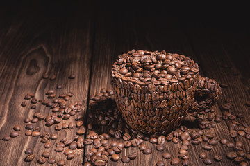 Natural coffee beans arabica. Horizontal background in brown tones. Coffee Cup Table Tree. Cup of...