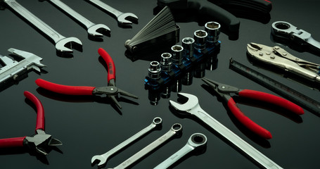 Set of mechanic tools. Chrome wrenches or spanners, hexagon socket, end cutter pliers, locking pliers, vernier caliper, pincers, feeler gauge, and tape measure. Chrome vanadium spanner wrench.
