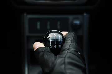 Gear lever. Manual Transmission. Hand on the gear shift in a car.