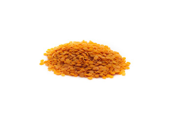 handful of red lentils on a white background