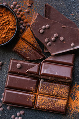 chocolate (delicious cocoa dessert, pieces of sweets) menu concept. food background. top view. copy space
