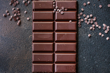 chocolate (delicious cocoa dessert, pieces of sweets) menu concept. food background. top view. copy space