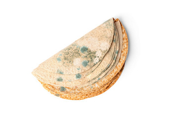 Tortilla with mold isolated on white background.