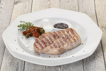 Grilled pork steak with pepper sauce