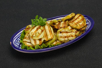 Grilled eggplant slices served basil